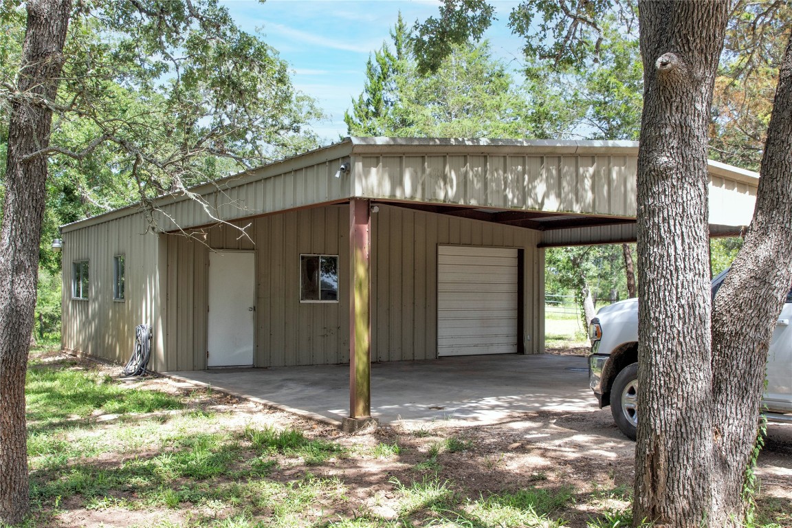6750 Three Mile Road Flatonia, TX 78941 - Photo 30 of 35 a view of a house with a small yard and large tree