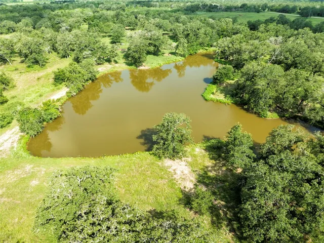 a view of lake with green space