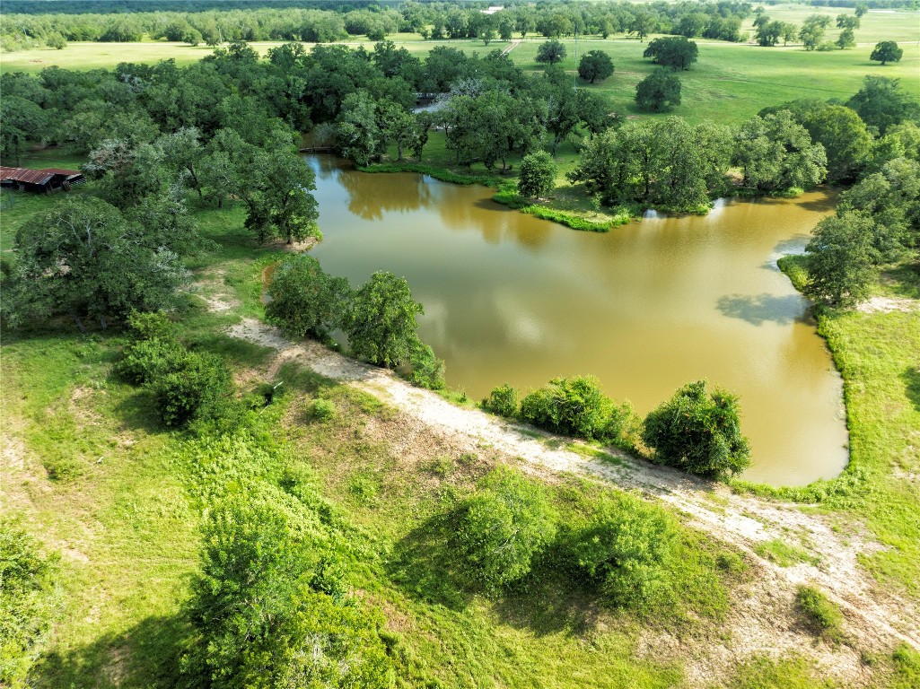 6750 Three Mile Road Flatonia, TX 78941 - Photo 4 of 35 a view of a lake with a yard