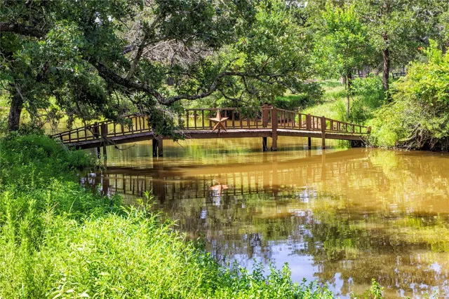 a view of a lake with a small yard