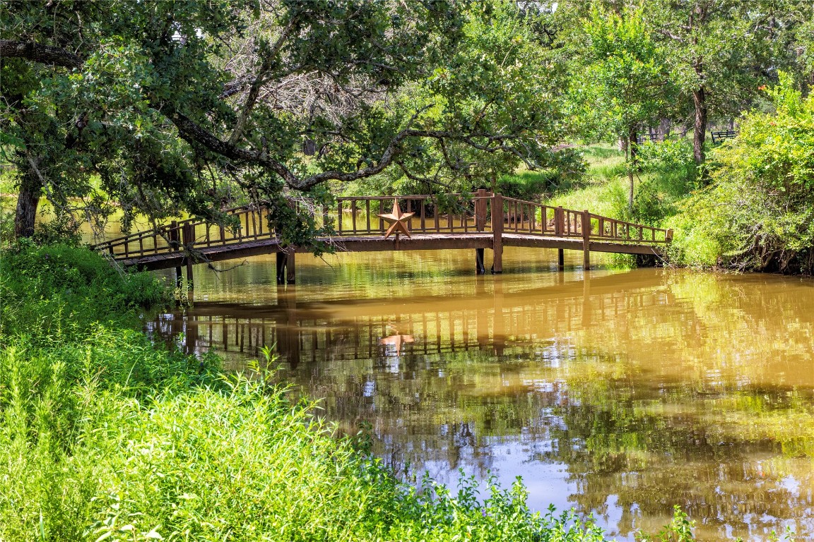 6750 Three Mile Road Flatonia, TX 78941 - Photo 5 of 35 a view of a lake with a small yard