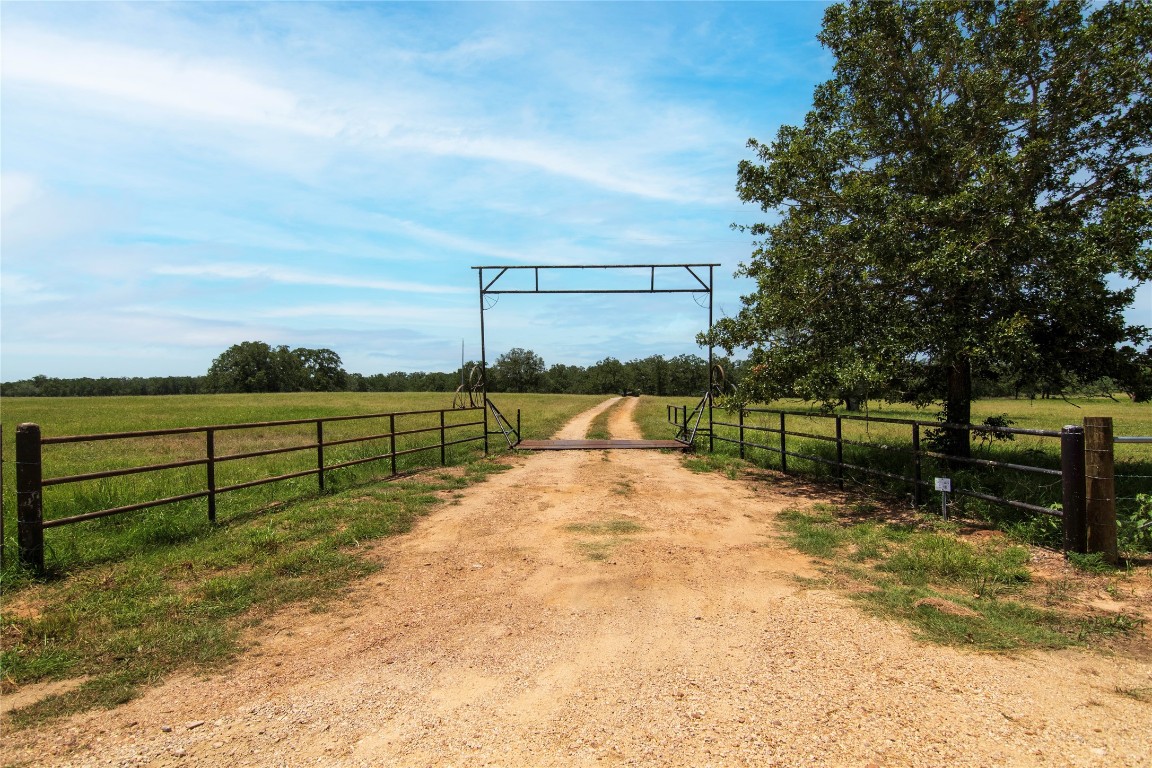 6750 Three Mile Road Flatonia, TX 78941 - Photo 8 of 35 a view of a yard with wooden fence
