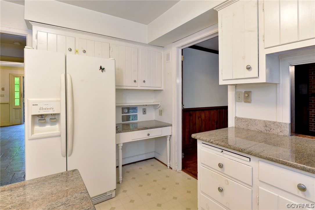 102 Wake Robin Road Williamsburg, VA 23185 - Photo 15 of 35 a kitchen with white cabinets and refrigerator