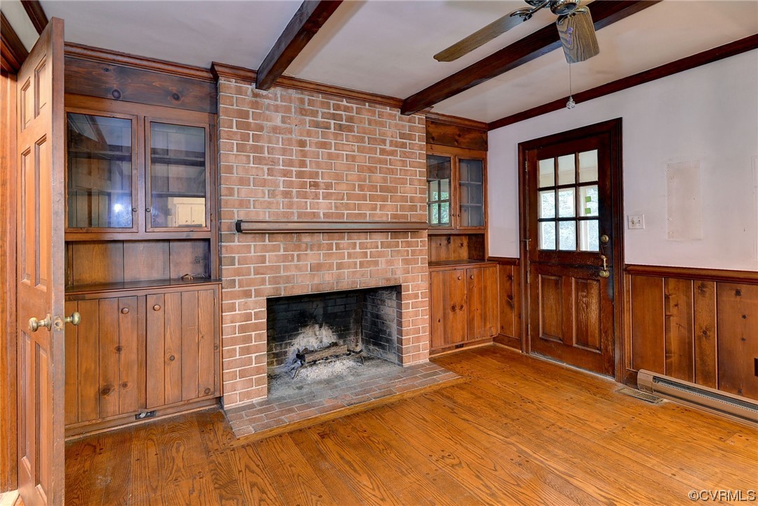 102 Wake Robin Road Williamsburg, VA 23185 - Photo 17 of 35 a view of an empty room with wooden floor and a fireplace