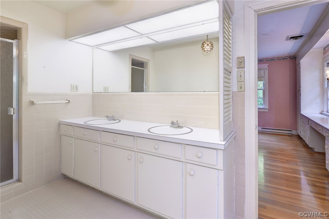 102 Wake Robin Road Williamsburg, VA 23185 - Photo 27 of 35 a bathroom with a sink a vanity and a mirror