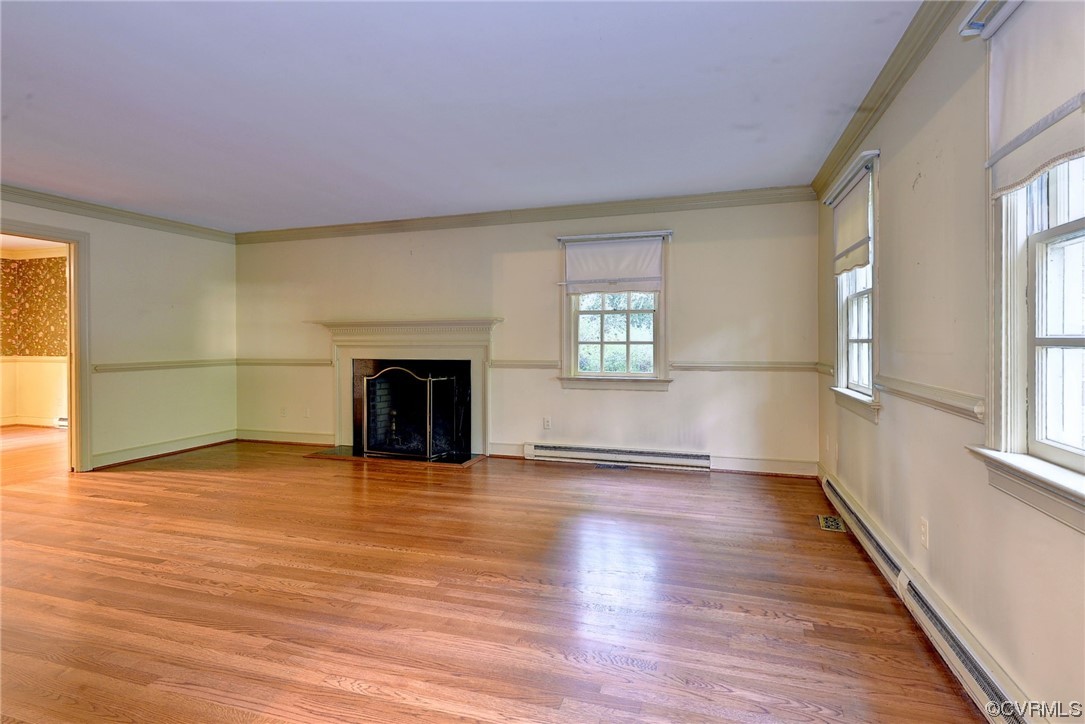 102 Wake Robin Road Williamsburg, VA 23185 - Photo 7 of 35 a view of an empty room with a window and fireplace