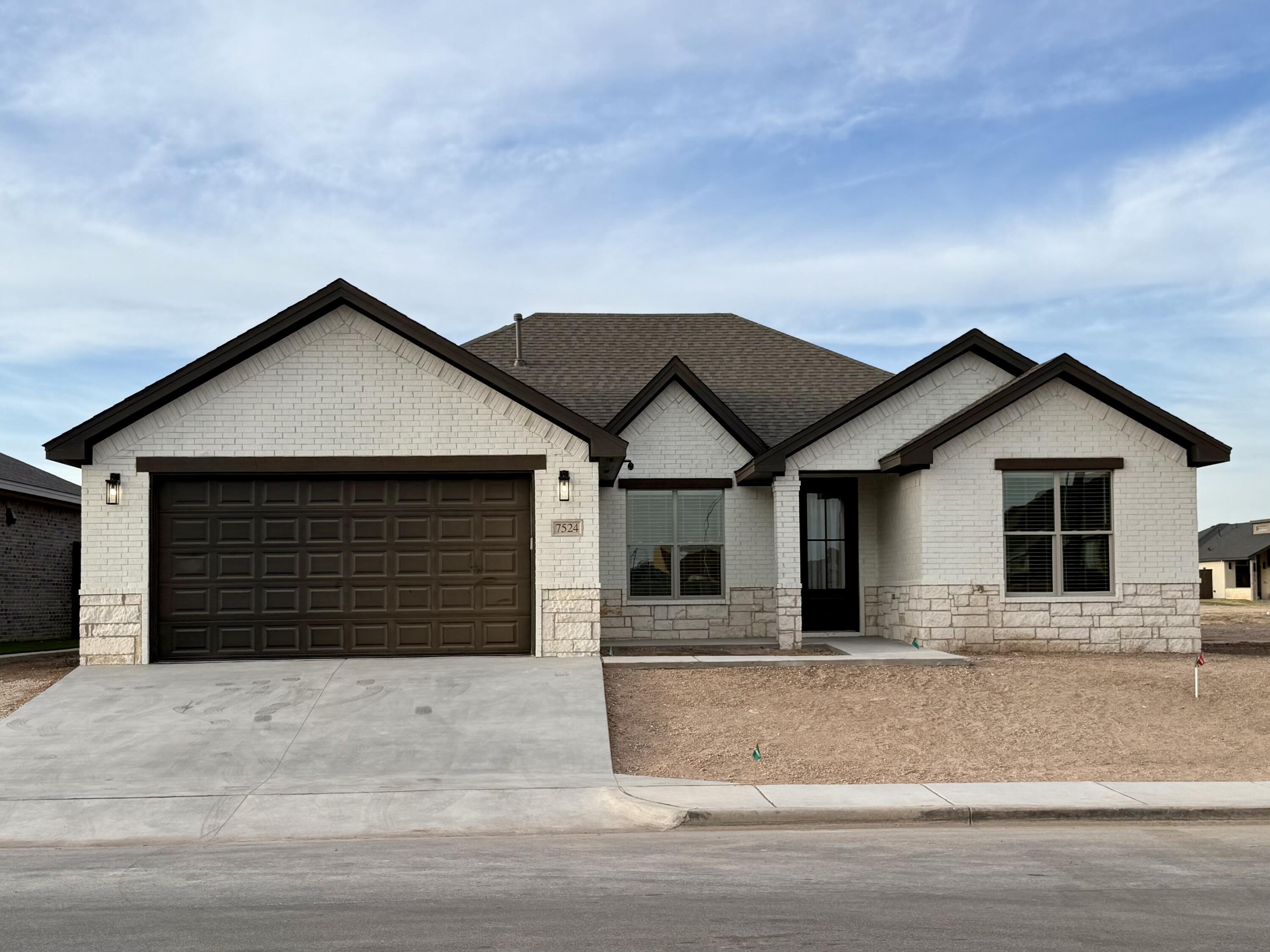 a front view of a house with a garage