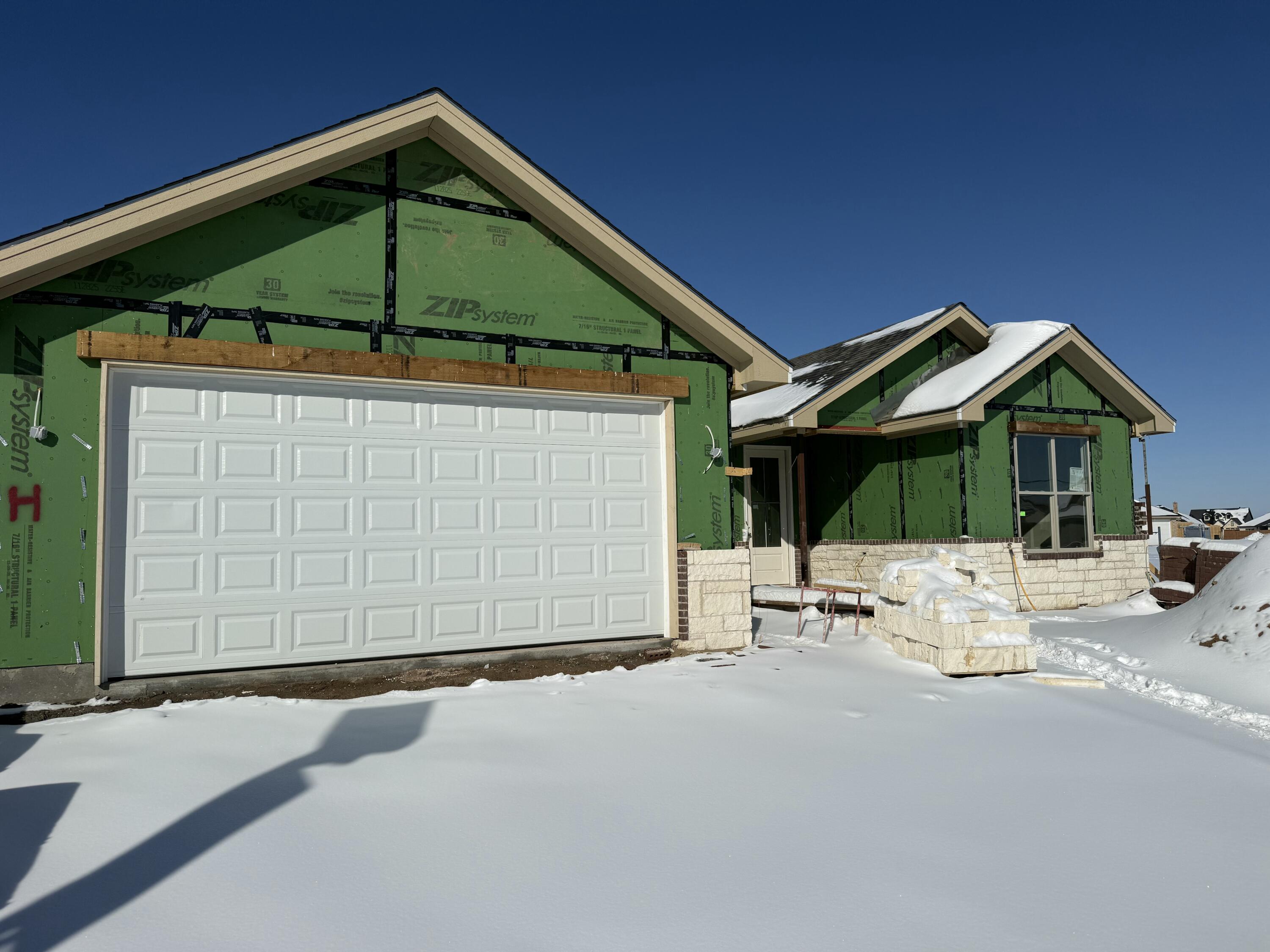 7524 58th Street Lubbock, TX 79407 - Photo 2 of 6 a blue and white umbrella sitting in front of a house