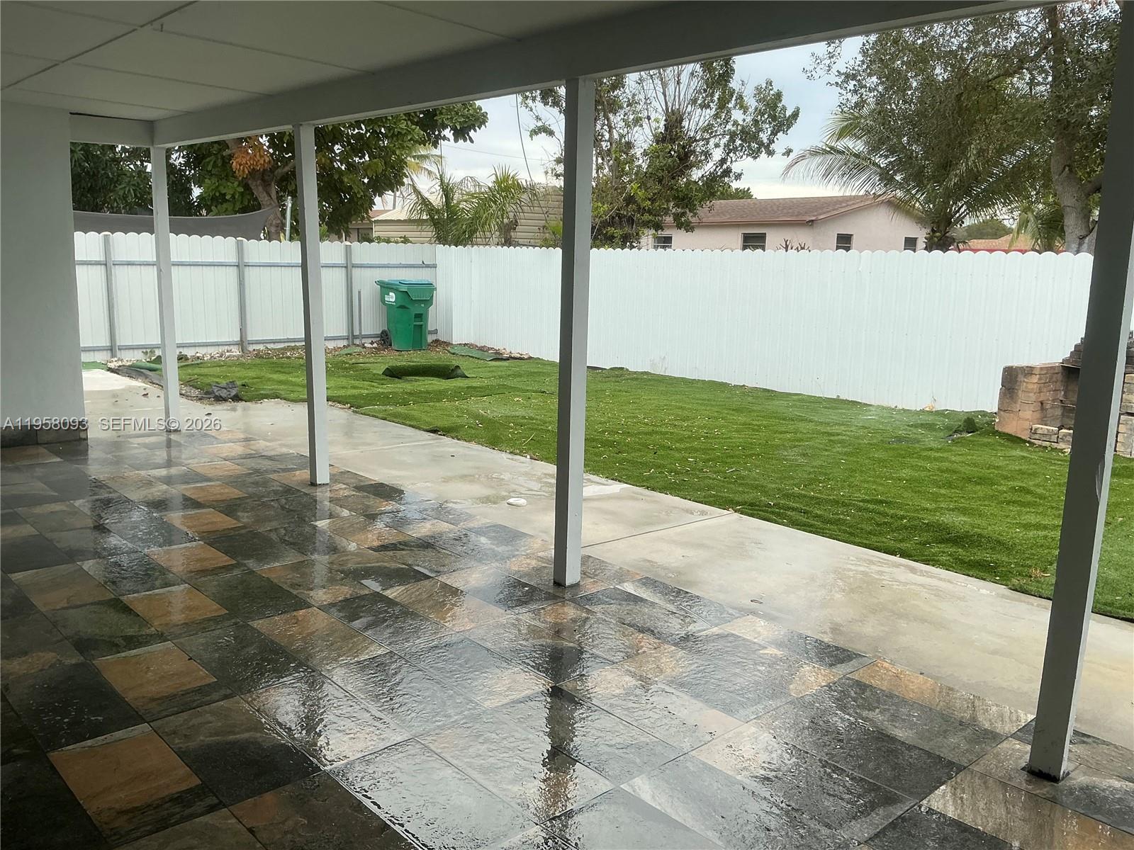 14821 Southwest 104th Avenue Miami, FL 33176 - Photo 2 of 4 a view of a backyard with porch