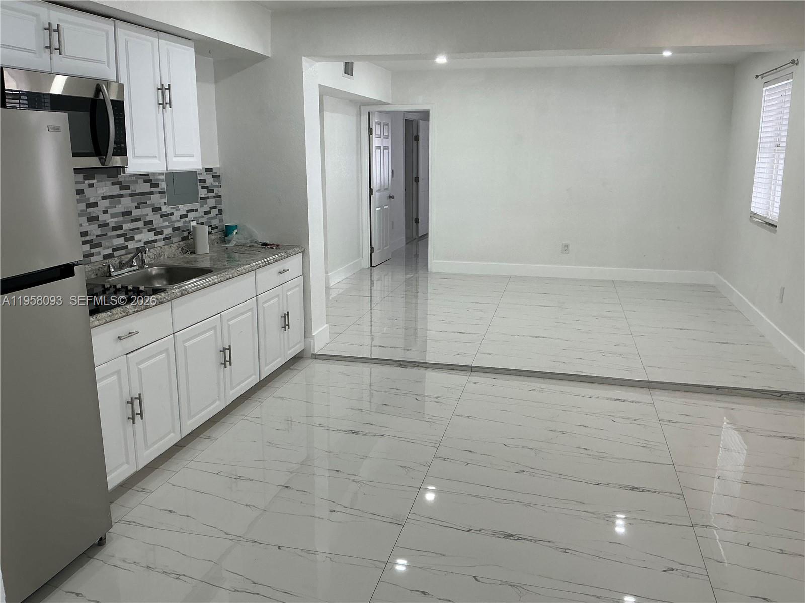 14821 Southwest 104th Avenue Miami, FL 33176 - Photo 4 of 4 a bathroom with a sink and a mirror