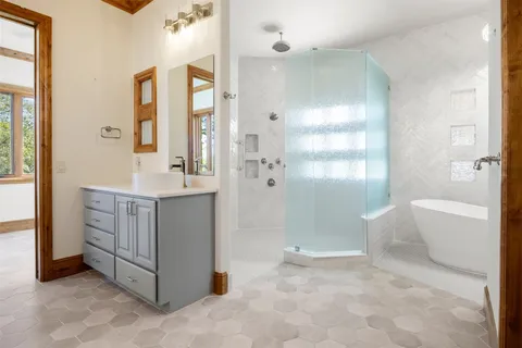 a view of a livingroom with workspace and a window