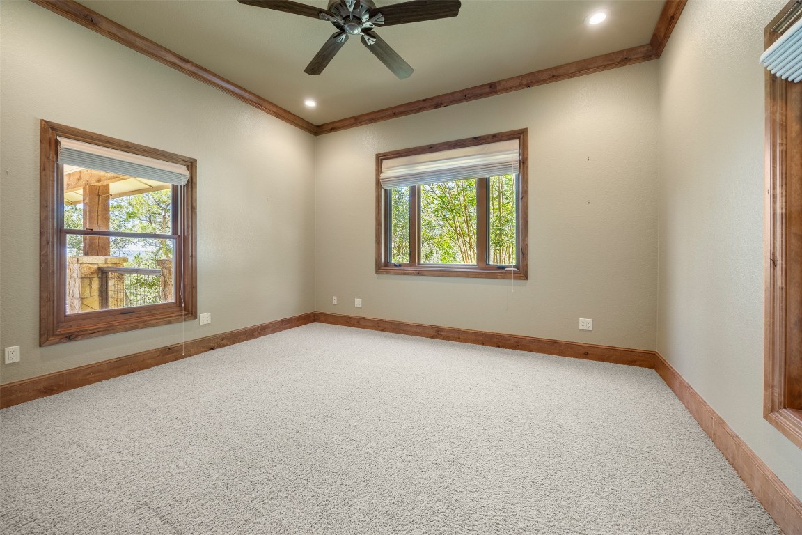 470 Inspiration Trail Wimberley, TX 78676 - Photo 29 of 30 an empty room with windows and fan