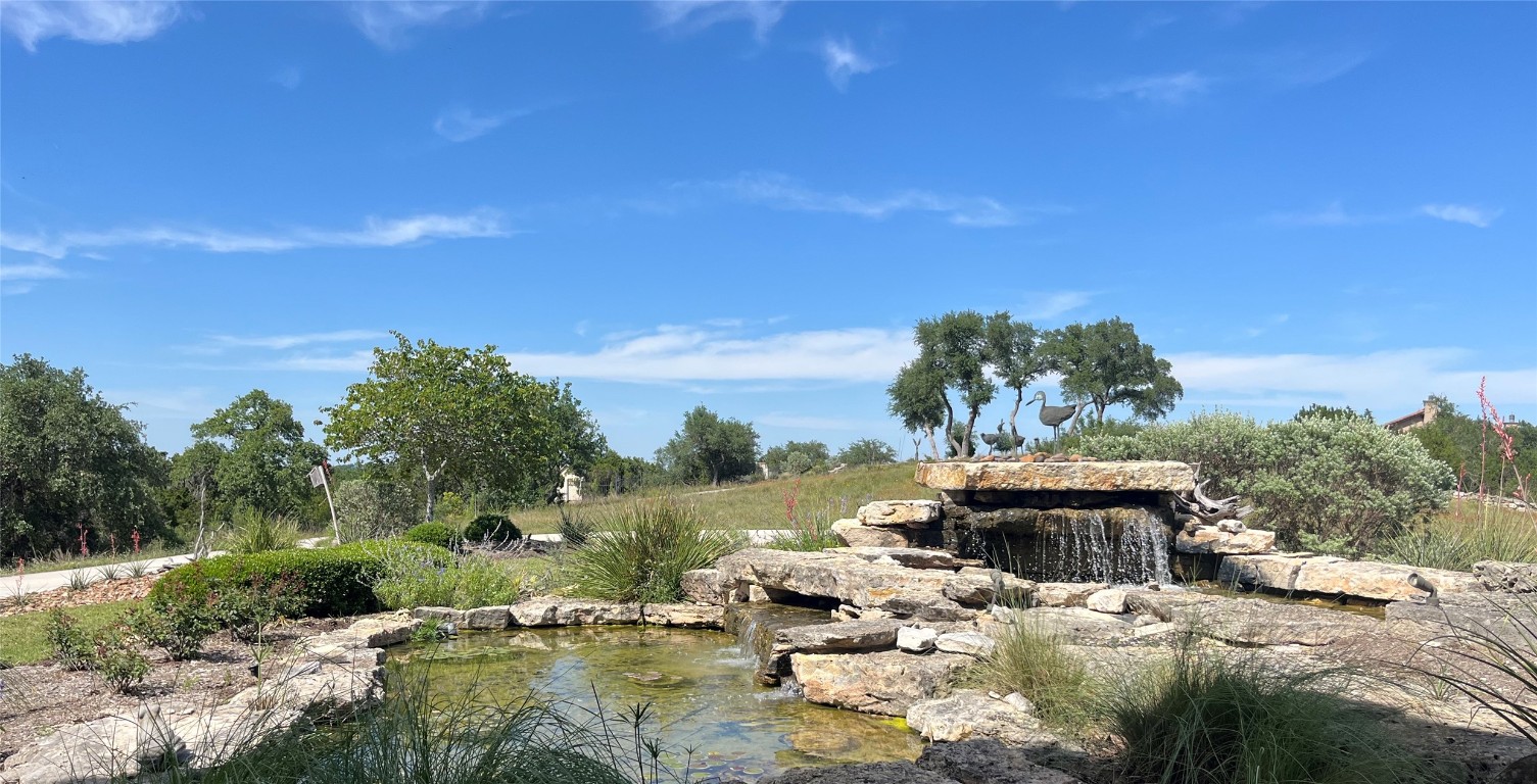 470 Inspiration Trail Wimberley, TX 78676 - Photo 6 of 30 a view of swimming pool with a yard and outdoor seating