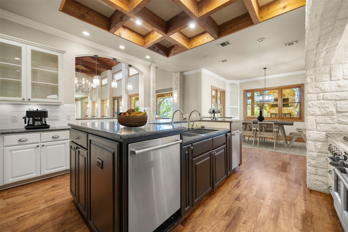470 Inspiration Trail Wimberley, TX 78676 - Photo 10 of 30 a kitchen with stainless steel appliances granite countertop a stove and cabinets