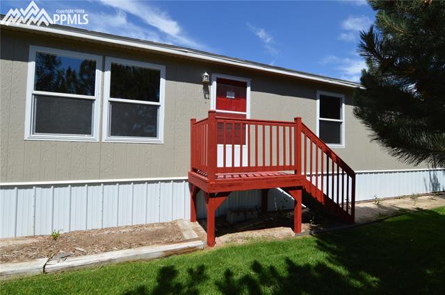 27055 Handle Road Calhan, CO 80808 - Photo 1 of 25 The front door to the home. All new vinyl windows throughout the home.