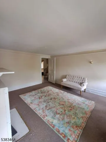 a view of a bedroom with a bed and couch