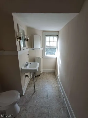 a bathroom with a toilet and a sink