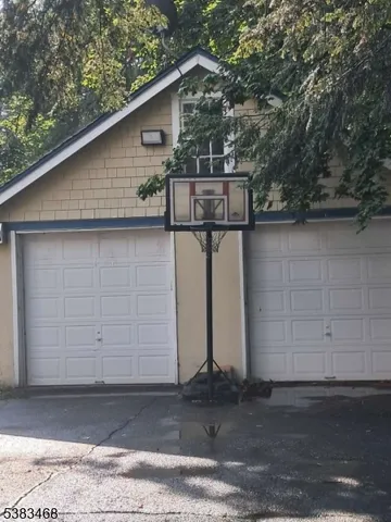 a side view of a house with garage