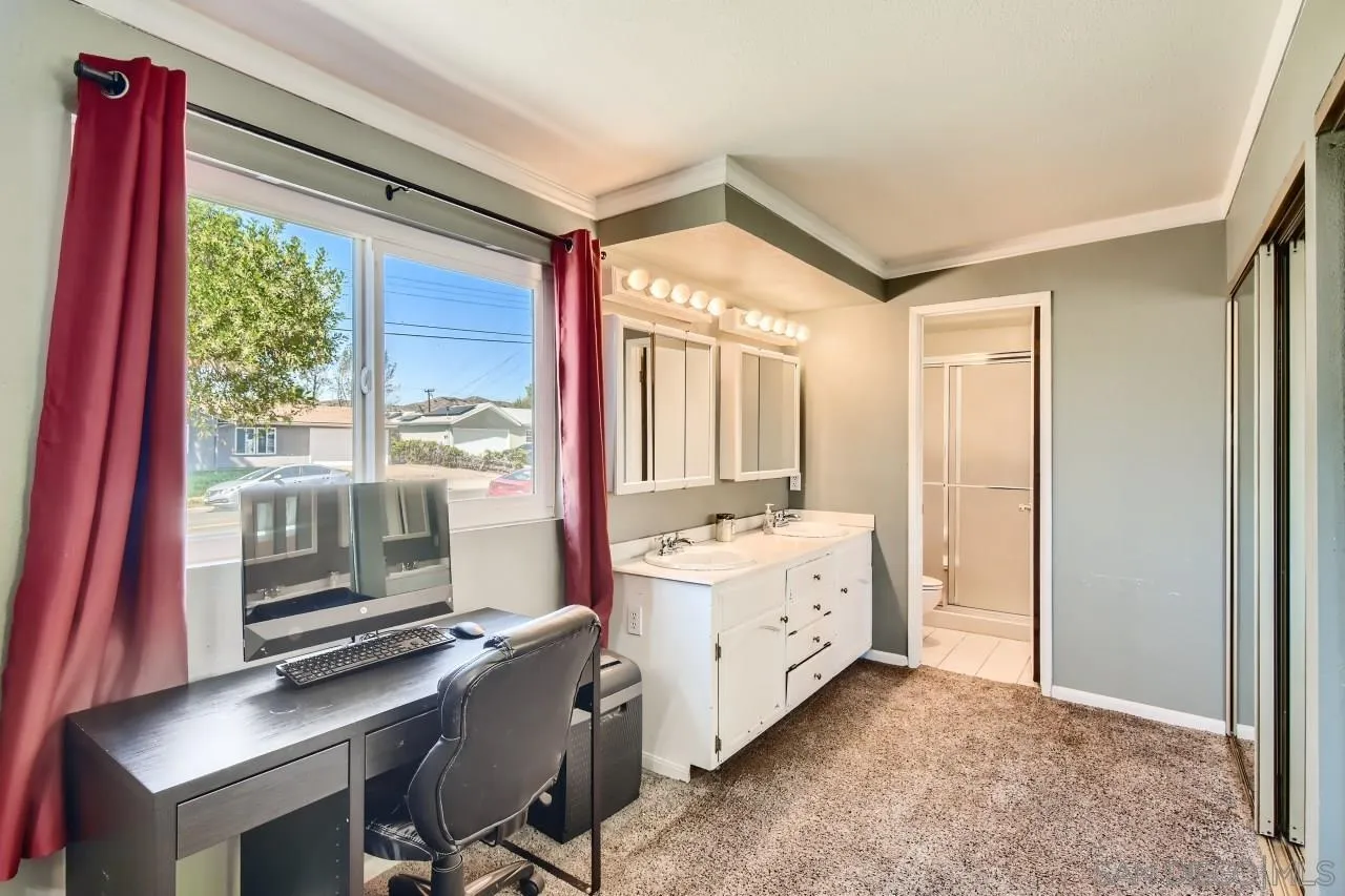 9539 Domer Road Santee, CA 92071 - Photo 14 of 22 a room with a bed and a desk