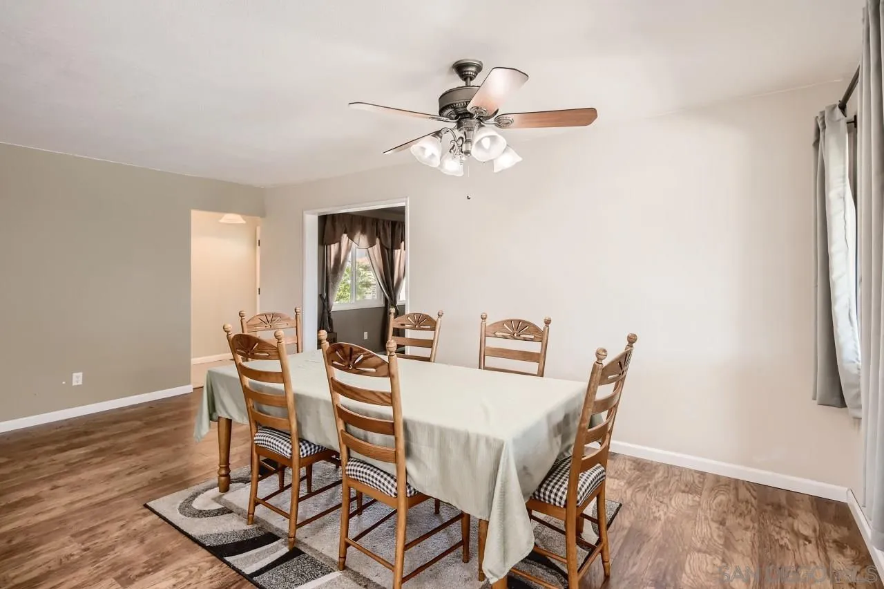 9539 Domer Road Santee, CA 92071 - Photo 5 of 22 a view of a dining room with furniture and a chandelier
