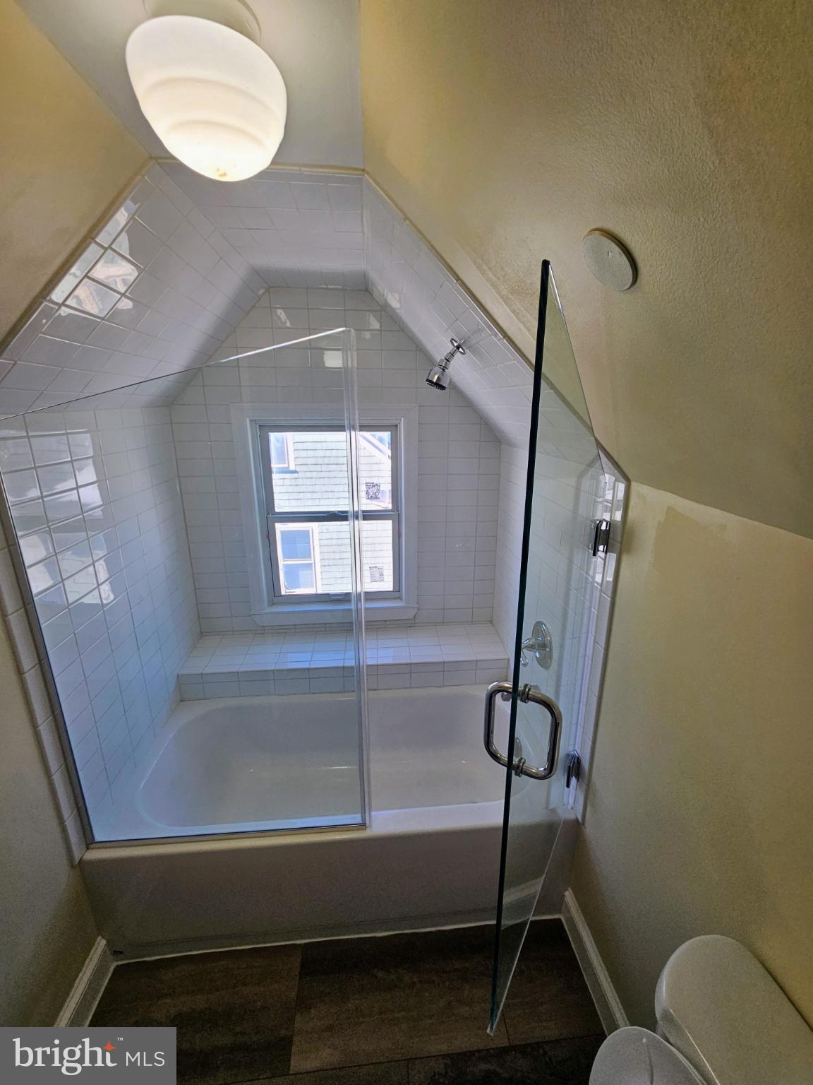 912 Riverside Avenue, Unit 3 Trenton, NJ 08618 - Photo 16 of 17 a bathroom with a bathtub and a shower