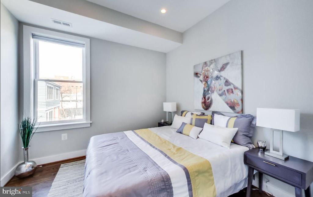 726 Girard Street Northwest, Unit 2 Washington, DC 20001 - Photo 11 of 18 a bedroom with a bed and a window
