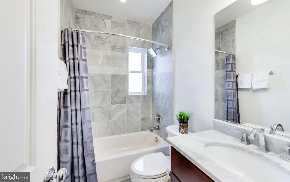 726 Girard Street Northwest, Unit 2 Washington, DC 20001 - Photo 12 of 18 a bathroom with a sink toilet and shower