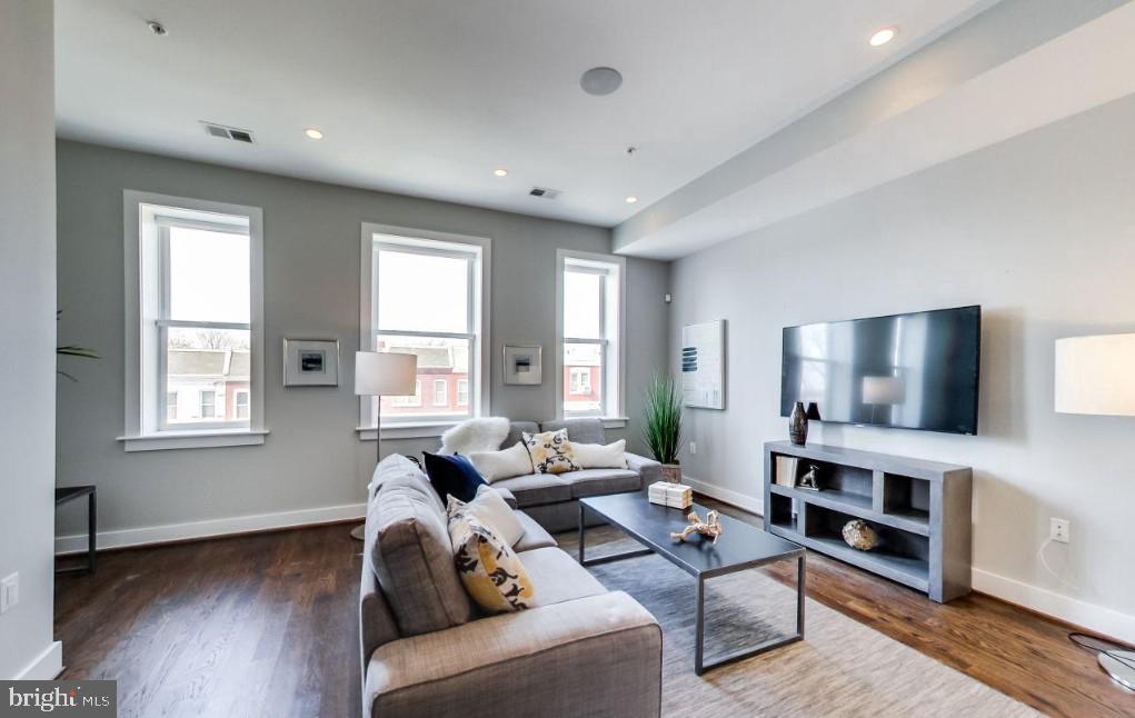 726 Girard Street Northwest, Unit 2 Washington, DC 20001 - Photo 4 of 18 a living room with furniture window and a flat screen tv