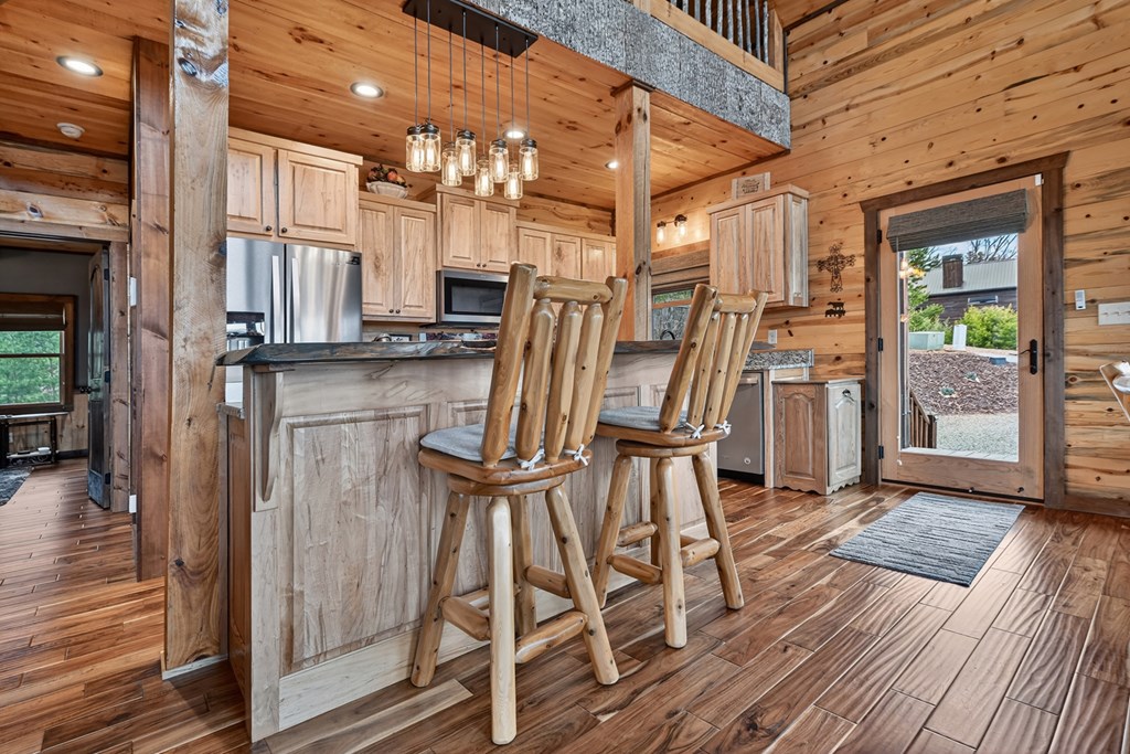 467 Deer Crest Road Blue Ridge, GA 30513 - Photo 13 of 79 a view of dining room with wooden floor and chairs