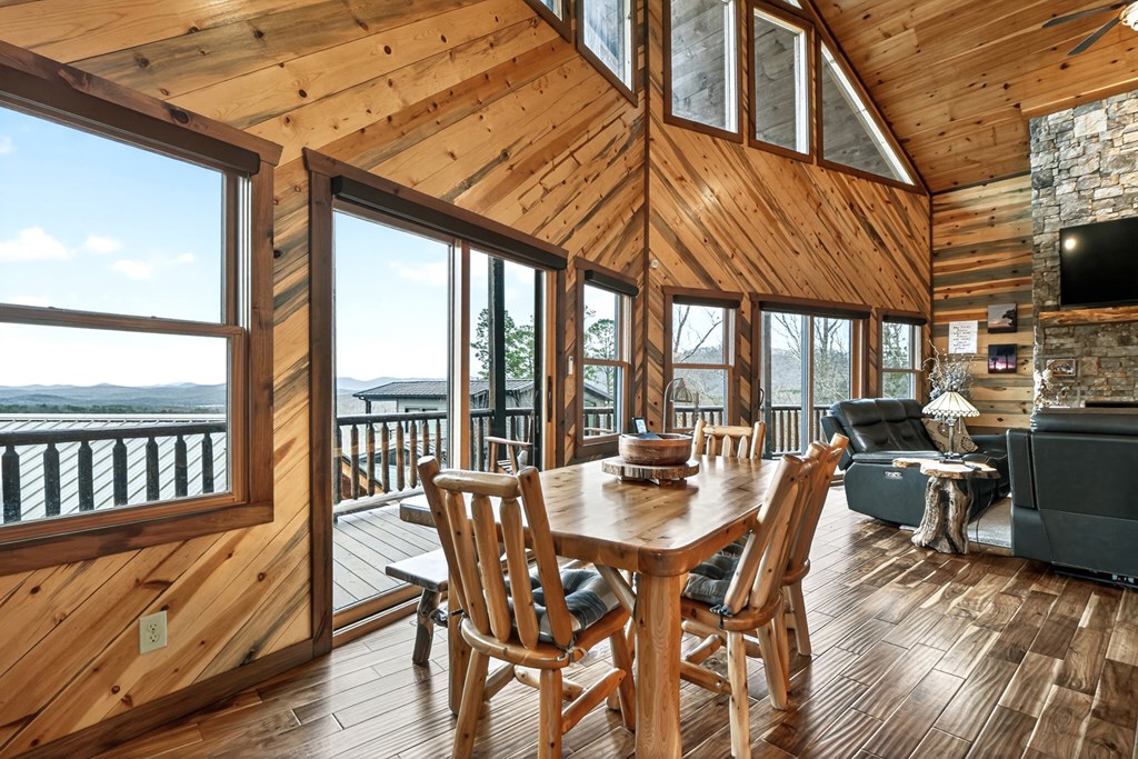 467 Deer Crest Road Blue Ridge, GA 30513 - Photo 14 of 79 a view of a dining room with furniture window and wooden floor