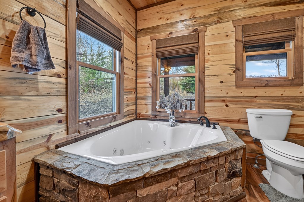 467 Deer Crest Road Blue Ridge, GA 30513 - Photo 22 of 79 a bathroom with a granite countertop sink and a toilet