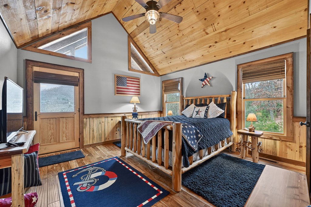 467 Deer Crest Road Blue Ridge, GA 30513 - Photo 26 of 79 a bed sitting in a bedroom next to a window