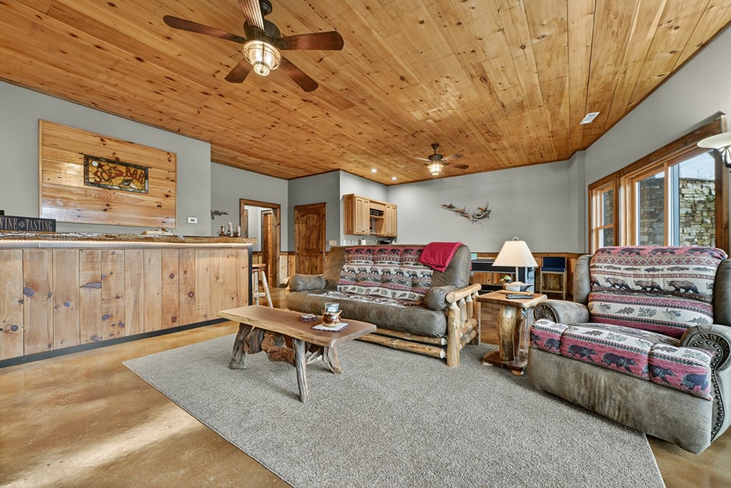 467 Deer Crest Road Blue Ridge, GA 30513 - Photo 34 of 79 a living room with furniture and a chandelier