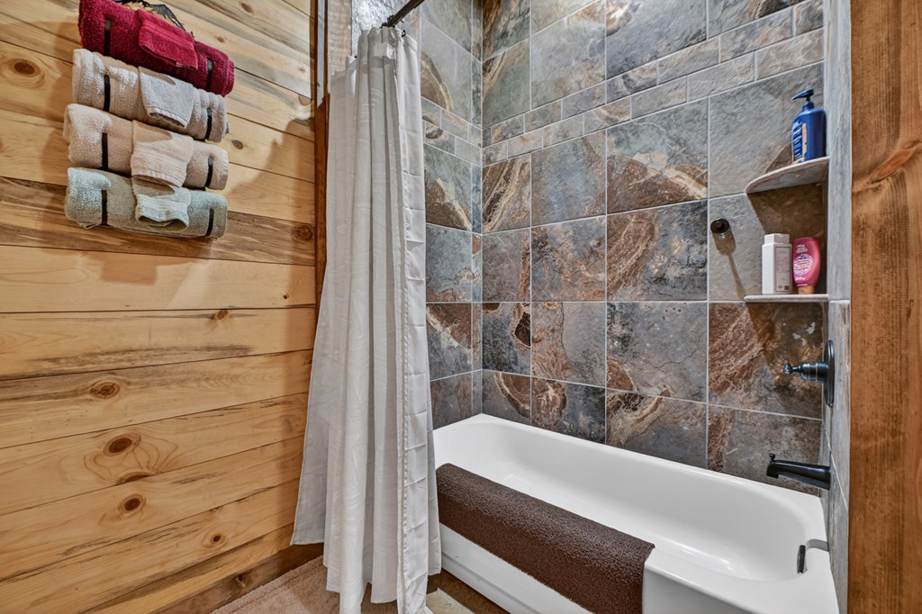 467 Deer Crest Road Blue Ridge, GA 30513 - Photo 41 of 79 a bathroom with a bathtub and shower