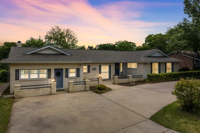 a view of a house with couches in front of house