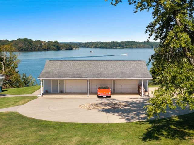 a view of wooden deck with a lake view