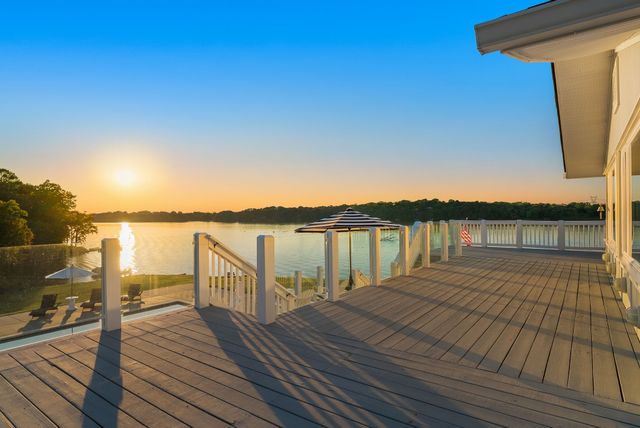 a swimming pool view with a seating space