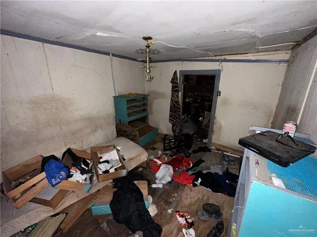 a lobby with furniture and a chandelier