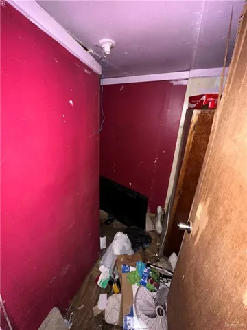 a room with gym equipment and a flat screen tv