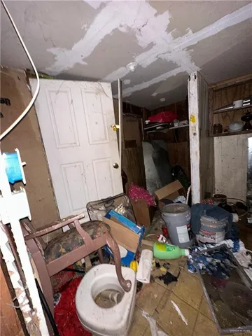 a bed room with a bed and a television