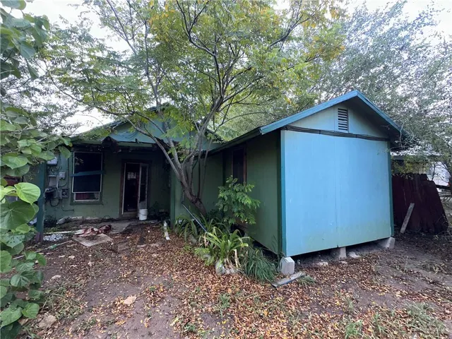 a view of a living room with furniture and a rug