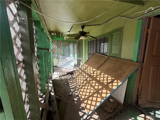 a living room with furniture and appliances