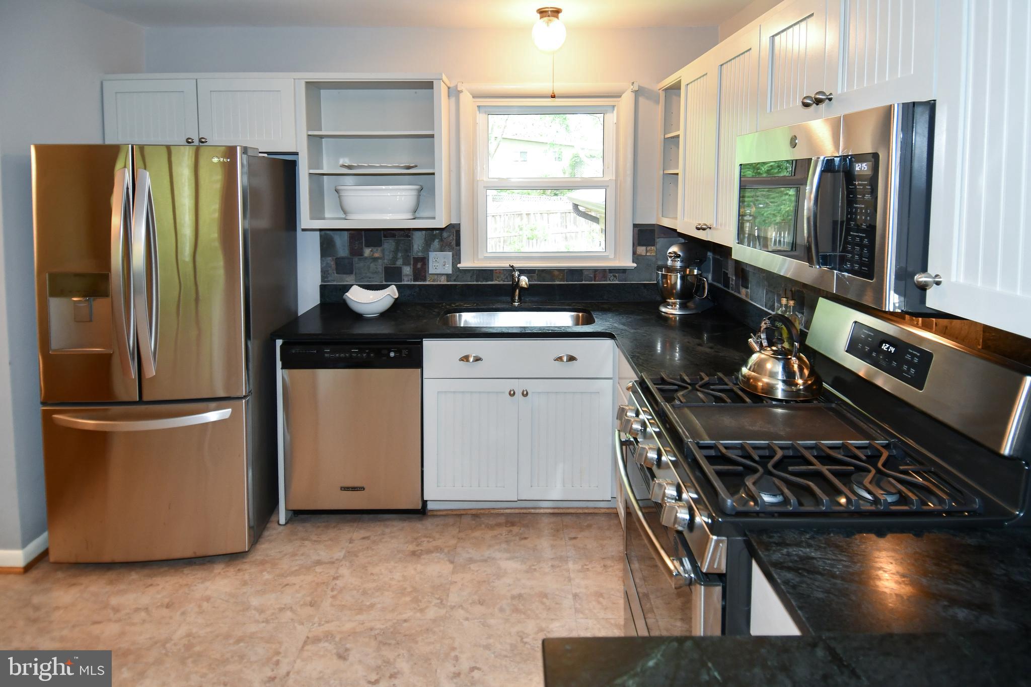 8916 Battery Road Alexandria, VA 22308 - Photo 16 of 53 French Door Refrigerator and Gas Stove.