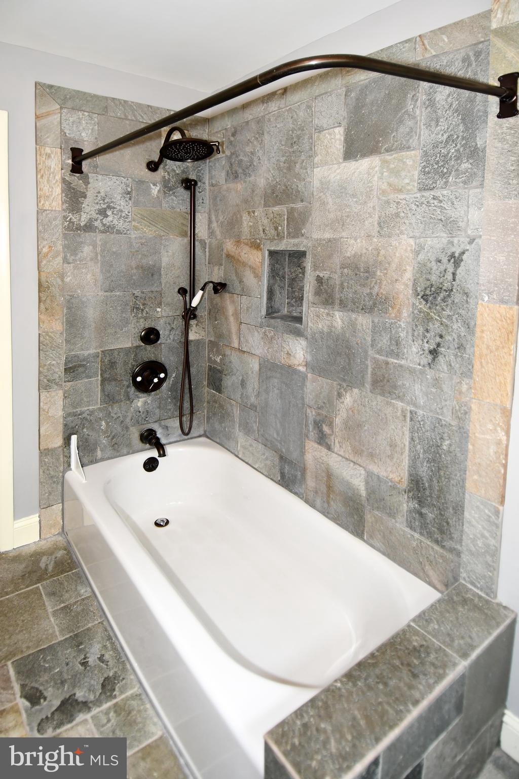 8916 Battery Road Alexandria, VA 22308 - Photo 42 of 53 Tub shower with curtain rod.