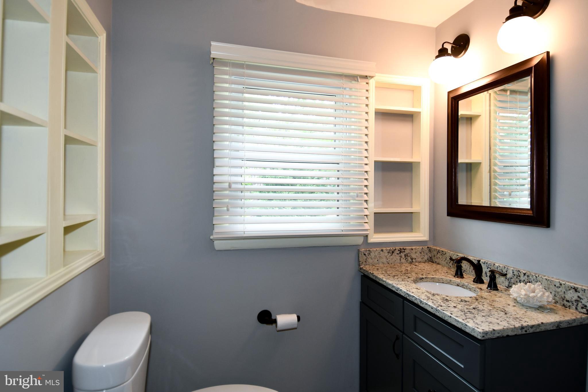 8916 Battery Road Alexandria, VA 22308 - Photo 43 of 53 Good lighting with shelving.