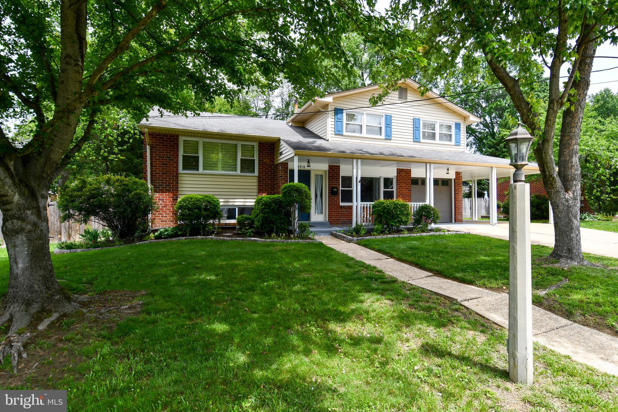 8916 Battery Road Alexandria, VA 22308 - Photo 53 of 53 Tree shaded front yard. Hose bibs in front & back