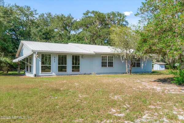 front view of a house with a big yard