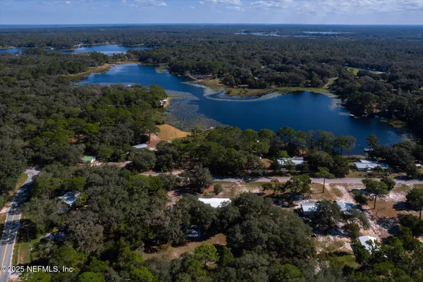 an aerial view of residential house and outdoor space