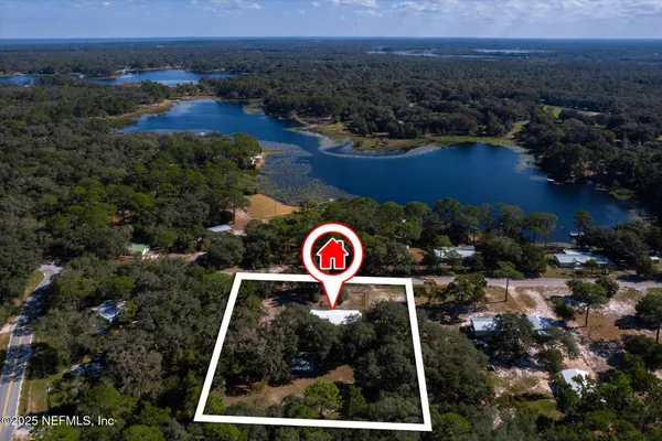 an aerial view of residential house with outdoor space