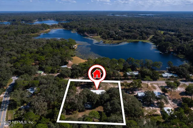 an aerial view of residential house with outdoor space